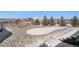 Scenic backyard features decorative rock, trees, and privacy fence at 11541 Quartzite Way, Parker, CO 80138