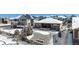 Aerial view of landscaped backyard features a stone ground cover and outdoor living space at 11541 Quartzite Way, Parker, CO 80138