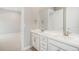 Bathroom with double sinks, large mirror, and storage at 11541 Quartzite Way, Parker, CO 80138