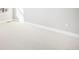Large bedroom area with light beige carpeting and white baseboards at 11541 Quartzite Way, Parker, CO 80138