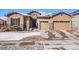 Charming home featuring stone accents, a two-car garage, and well-maintained landscaping at 11541 Quartzite Way, Parker, CO 80138