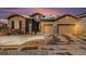 Charming home featuring stone accents, a two-car garage, and well-maintained landscaping at 11541 Quartzite Way, Parker, CO 80138