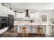 Well-equipped kitchen with a large island, modern appliances, and sleek countertops at 11541 Quartzite Way, Parker, CO 80138