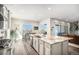 Bright eat-in kitchen with a large island, stainless steel appliances, and plenty of natural light at 11541 Quartzite Way, Parker, CO 80138