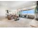 Bright and airy living room with sliding glass doors to a balcony with mountain views at 11541 Quartzite Way, Parker, CO 80138