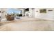 Spacious living room with a cozy fireplace, large windows, and neutral carpet at 11541 Quartzite Way, Parker, CO 80138