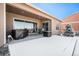 Covered patio with hot tub, chairs, and grill at 11541 Quartzite Way, Parker, CO 80138