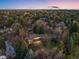 Birds eye view of the large lot and surrounding homes at dusk at 7 Cherry Hills Farm Dr, Cherry Hills Village, CO 80113