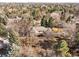 An aerial view of a home surrounded by dense foliage, offering privacy and a serene environment at 7 Cherry Hills Farm Dr, Cherry Hills Village, CO 80113
