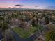 An aerial view showcasing the neighborhood and large lot at 7 Cherry Hills Farm Dr, Cherry Hills Village, CO 80113