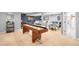 Spacious finished basement with shuffleboard table, game and recreation space, and full bathroom at 7 Cherry Hills Farm Dr, Cherry Hills Village, CO 80113
