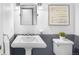 Clean and classic bathroom with a pedestal sink, wainscoting, and traditional fixtures at 7 Cherry Hills Farm Dr, Cherry Hills Village, CO 80113