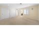 Bright bedroom with neutral walls, large closets, recessed lighting, and entry to ensuite bathroom at 7 Cherry Hills Farm Dr, Cherry Hills Village, CO 80113
