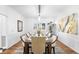 Formal dining room with a long table, seating for ten, and decorative lighting at 7 Cherry Hills Farm Dr, Cherry Hills Village, CO 80113
