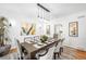 Dining room featuring a dark wood table and chandelier lighting at 7 Cherry Hills Farm Dr, Cherry Hills Village, CO 80113