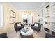 Open-concept living room featuring a built-in bookshelf and a checkered tile floor at 7 Cherry Hills Farm Dr, Cherry Hills Village, CO 80113