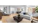 Open living space features neutral tones, hardwood floors and lots of room for seating at 7 Cherry Hills Farm Dr, Cherry Hills Village, CO 80113