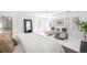 Bright bedroom with a decorative fireplace and sitting area by the windows at 7 Cherry Hills Farm Dr, Cherry Hills Village, CO 80113