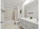Spacious bathroom features a dual sink vanity, shower and bath combo, offering convenience and comfort at 6024 High Timber Cir, Castle Rock, CO 80104