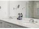 Bathroom with double vanity, a marble countertop and a clear glass shower at 6024 High Timber Cir, Castle Rock, CO 80104