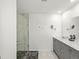 Modern bathroom featuring double vanity, marble countertops, and spacious glass shower at 6024 High Timber Cir, Castle Rock, CO 80104