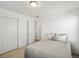 Well-lit bedroom boasts neutral tones, carpet, soft bedding, and closet doors for a soothing retreat at 6024 High Timber Cir, Castle Rock, CO 80104