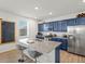 Gourmet kitchen with stainless steel appliances, granite countertops, and ample cabinet space at 6024 High Timber Cir, Castle Rock, CO 80104