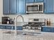 Close up of kitchen featuring granite countertops, stainless steel appliances and subway tile backsplash at 6024 High Timber Cir, Castle Rock, CO 80104