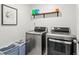 Functional laundry room equipped with modern washer and dryer units, offering convenience for chores at 6024 High Timber Cir, Castle Rock, CO 80104