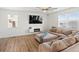 Bright living room with hardwood floors, fireplace, and a comfortable sectional sofa at 6024 High Timber Cir, Castle Rock, CO 80104