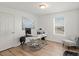 Well-lit home office with wood flooring and a view, perfect for work or study at 6024 High Timber Cir, Castle Rock, CO 80104
