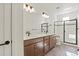 Modern bathroom featuring double vanity with stylish fixtures and glass enclosed shower at 2849 E 103Rd Dr, Thornton, CO 80229