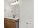 Bright bathroom featuring a modern vanity with double sinks and a large mirror at 2849 E 103Rd Dr, Thornton, CO 80229