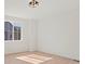 Bright bedroom with hardwood floors and natural light from a large window at 2849 E 103Rd Dr, Thornton, CO 80229