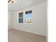 Bright bedroom with neutral carpet and ample natural light from two windows at 2849 E 103Rd Dr, Thornton, CO 80229
