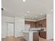 The kitchen features modern appliances, a spacious island, and warm wood cabinets at 2849 E 103Rd Dr, Thornton, CO 80229