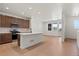 Spacious kitchen with an island, stainless steel appliances, and lots of natural light at 2849 E 103Rd Dr, Thornton, CO 80229