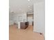Open kitchen and living area featuring an island and modern appliances at 2849 E 103Rd Dr, Thornton, CO 80229