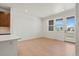 Open concept living room and kitchen area with abundant natural light at 2849 E 103Rd Dr, Thornton, CO 80229