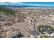 An aerial view of this grand estate surrounded by mature trees and mountain views at 1252 Rosewind Cir, Castle Rock, CO 80104