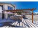 An outdoor patio with a pizza oven and stone cooking area, perfect for backyard entertaining at 1252 Rosewind Cir, Castle Rock, CO 80104
