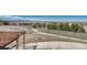 Expansive backyard featuring a fire pit, bocce ball court and beautiful landscape views at 1252 Rosewind Cir, Castle Rock, CO 80104