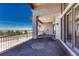 A covered balcony with wrought iron railing showcases the spectacular scenery at 1252 Rosewind Cir, Castle Rock, CO 80104