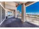 Covered balcony space with stone columns perfect for enjoying the outdoors and expansive views at 1252 Rosewind Cir, Castle Rock, CO 80104