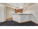 Stylish wet bar with wood cabinetry, granite countertop, and pendant lighting, perfect for entertaining guests at 1252 Rosewind Cir, Castle Rock, CO 80104