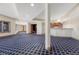 Finished basement offering a stylish wet bar and patterned carpeting at 1252 Rosewind Cir, Castle Rock, CO 80104