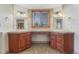 Bathroom featuring a dual vanity with wood cabinets and decorative lighting at 1252 Rosewind Cir, Castle Rock, CO 80104
