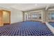 Expansive bedroom with natural light, a large window, and wooden doors at 1252 Rosewind Cir, Castle Rock, CO 80104