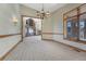 Elegant dining room featuring carpeted floors, a decorative chandelier, and large windows with scenic views at 1252 Rosewind Cir, Castle Rock, CO 80104