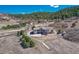 Beautiful home set against a backdrop of lush greenery and mountain views from a circular driveway at 1252 Rosewind Cir, Castle Rock, CO 80104